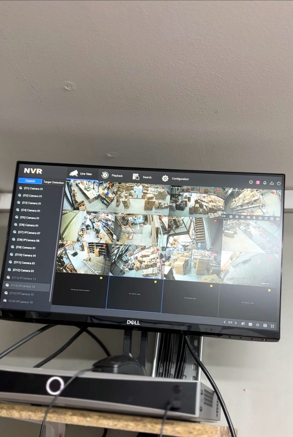 NVR multi-camera display showing live CCTV feeds across a site